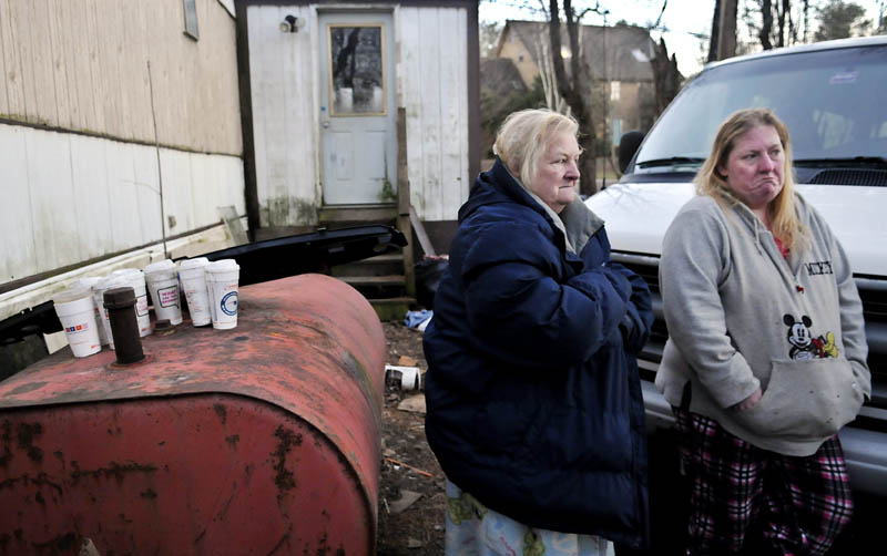 Judith Farris, left, and her daughter, Becky Ratcliff, may be moving from their China home, if the town carries out an order to raze the trailer and outbuilding.