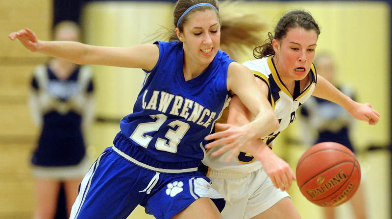 Lawrence High School's Paige Belanger left, and Mt. Blue High School's Miranda Nicely battle for the loose ball in the second quarter Friday at Mt. Blue High School in Farmington.