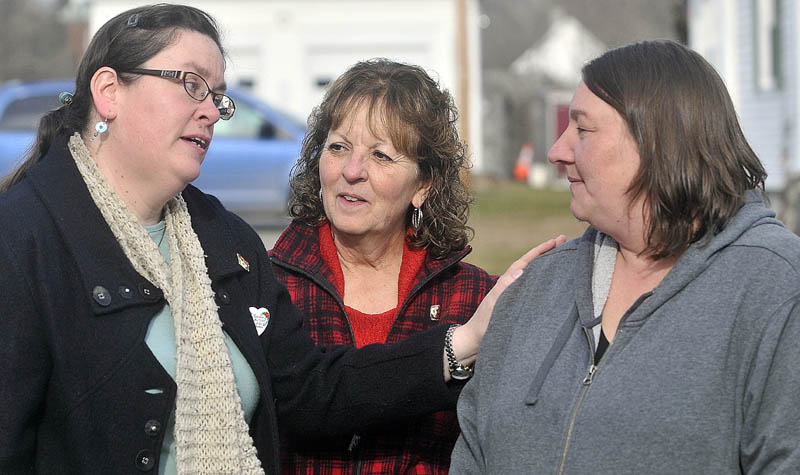 Laurie Ann Robbins, left, and Christine Belangia, center, comfort Terri Foulkes, right, daughter of murder victim Rita St. Peter, outside the Somerset County Superior Court House in Skowhegan, after the sentencing of Jay Mercier for the 1980 murder of Rita St. Peter on Friday. Belangia was St. Peter's sister; Robbins was a friend.