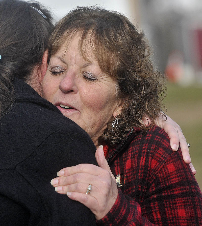Christine Belangia, right, hugs Laurie Ann Robbins, left, following the sentencing of Jay Mercier at the Somerset County Superior Court House in Skowhegan on Friday.