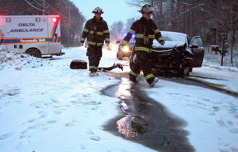 Firefighters from Winslow respond to a two-vehicle crash that closed Route 32 for about an hour Saturday afternoon. One person sustained minor injuries in the weather-related crash.