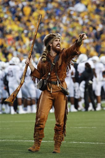 West Virginia University Mountaineer mascot Jonathan Kimble rallies fans during a game between WVU and University of Maryland in Morgantown, W.Va.