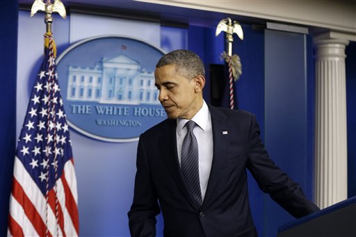 President Obama leaves the podium after speaking about the school shooting in Newtown, Conn., on Friday, in the briefing room of the White House. This evening, Obama will visit privately with families of the victims and with emergency personnel who responded to the shootings. He then will then speak at an interfaith vigil at Newtown High School.