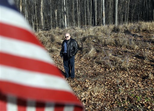 Lee Carlson, of Gardiner, N.Y., poses Thursday in a field of unmarked graves from the Revolutionary War in Fishkill, N.Y. Research conducted by a local historical organization has managed to put names to 25 soldiers out of the hundreds of soldiers believed to have been buried here during the American Revolution. Carlson's family tree includes Archelaus Towne, a 45-year-old captain from New Hampshire who fought at Bunker Hill and Saratoga before dying of dysentery and fever at Fishkill on Dec. 1, 1779.
