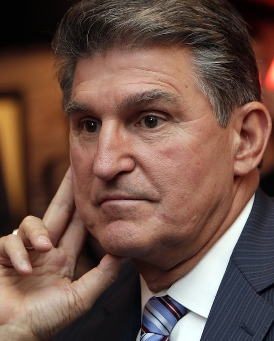 In this Nov. 6, 2012 file photo, Sen. Joe Manchin, D-WV., watches vote returns at his election watch party in Fairmont, W. Va. On Monday, Sen. Joe Manchin, a lifelong member of the National Rifle Association, said it was time to discuss gun policy and move toward action on gun regulation. (AP Photo/Dave Martin)