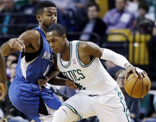 Boston Celtics point guard Rajon Rondo (9) drives against Minnesota Timberwolves guard Malcolm Lee, left, during the second half of an NBA basketball game in Boston, Wednesday. The Celtics won 104-94. TD Garden