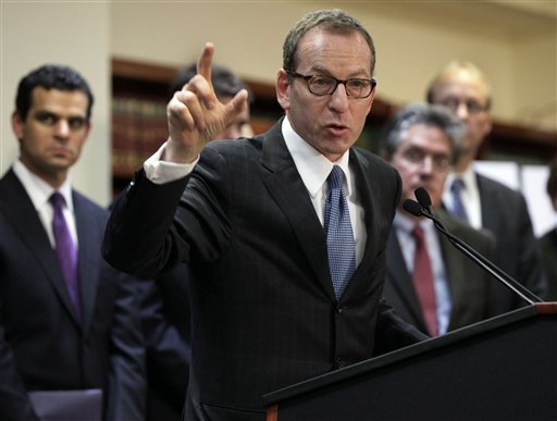 Lanny Breuer, center, assistant attorney general of the Justice Department's Criminal Division, addresses a news conference in on Dec. 11, 2012, to announce British bank HSBC agreed to pay $1.9 billion to settle money-laundering charges.