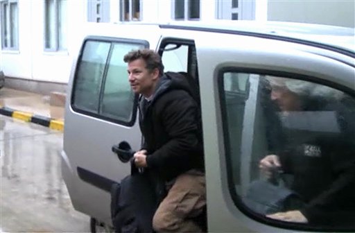 In this image from video, NBC chief foreign correspondent Richard Engel exits a car in Turkey after he and his television crew were freed unharmed following a firefight at a Syrian checkpoint.