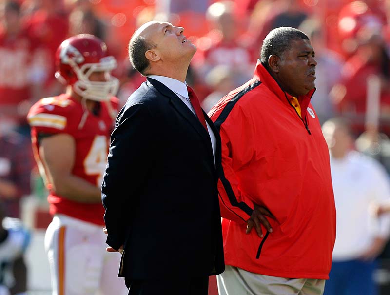 Kansas City Chiefs GM Scott Pioli, left, and Coach Romeo Crennel stand together before Sunday's game against the Carolina Panthers at Arrowhead Stadium in Kansas City, Mo. NFLACTION12;