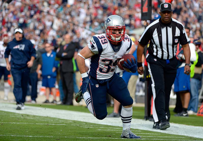 Patriots running back Danny Woodhead runs for a touchdown against the Jacksonville Jaguars on a 14-yard touchdown pass play at the end of the first half Sunday at Jacksonville, Fla. NFLACTION12;