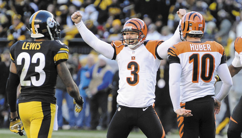 WE’RE IN: Cincinnati’s Josh Brown (3) celebrates hitting a 43-yard field goal with 4 seconds left in the Bengals’ 13-10 win over the Pittsburgh Steelers on Sunday in Pittsburgh. NFLACTION12;
