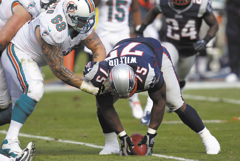 BIG PLAY VINCE: Defensive tackle Vince Wilfork (75) was a major contributor as the New England Patriots racked up a seven-game winning streak. NFLACTION12;