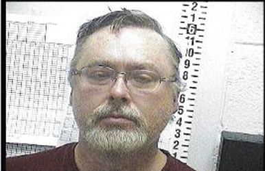 James Cameron's booking photo, from the Sandoval County Detention Center in New Mexico. Cameron, a former state prosecutor convicted of owning child pornography, fled the state in November and was captured by U.S. Marshals in early December.