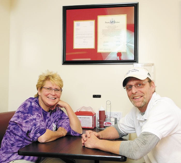 Laura Benedict, left, and Peter Benedict, sister and brother co-owners of The Red Barn, pose in the restaurant on Dec. 4, in Augusta.