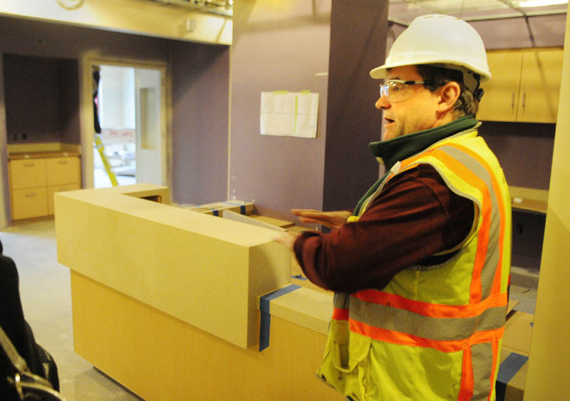 Dan Berube, onsite foreman for Windham Millwork, talks about the cabinets that workers have already installed during a tour on Dec. 4 at the new MaineGeneral regional hospital in Augusta. The cabinets, counters and some other items are pre-made back in the shop at Windham Millworks before being shipped up and installed.