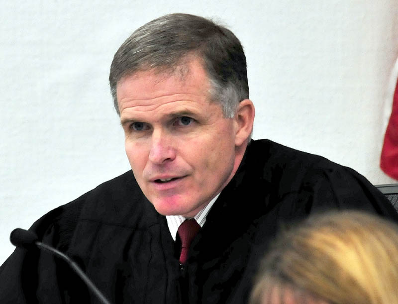 Justice John Nivison addresses the court prior to announcing his decision that Robert Nelson is guilty in the death of Everett L. Cameron in Somerset County Superior Court in Skowhegan on Tuesday, Dec. 18, 2012.