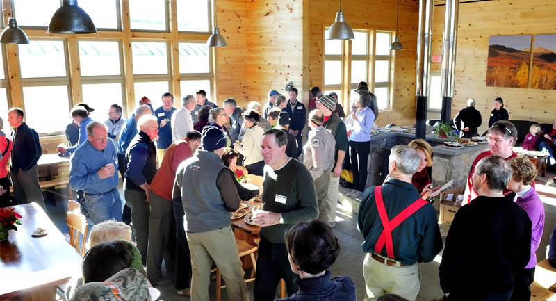 The new Stratton Brook Hut, the fourth building in the Maine Huts and Trails system, is full with organization members, supporters, and contributors during an official opening of the hut in Carrabassett Valley on Wednesday.