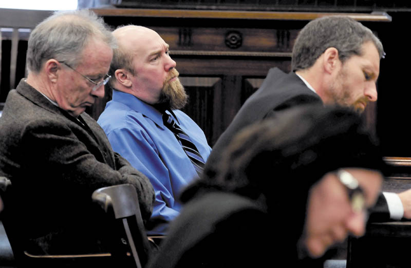 GUILTY: Murder defendant Robert Nelson, center, is flanked by his attorneys John Alsop, left, and Phil Mohlar before it was announced that he is guilty in the death of Everett L. Cameron in Somerset County Superior Court in Skowhegan on Tuesday, Dec. 18, 2012. State prosecutor Leane Zainea is in foreground.