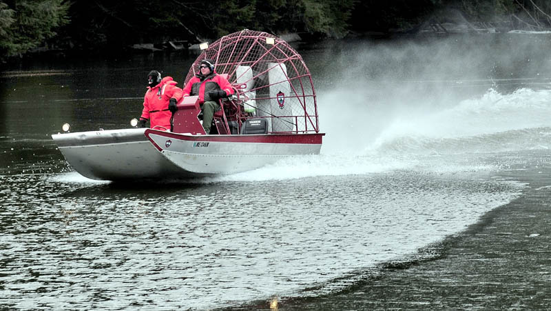 Searchers in a Maine Warden Service airboat motor on the ice-covered Messalonskee Stream in Waterville on Dec. 19, 2011, in search of missing 20-month-old Ayla Reynolds. The search area was concentrated below the dam near Western Avenue, a short distance from the Violette Avenue home from which she disappeared on Dec. 17, 2011.