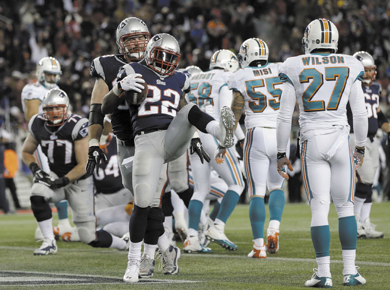 LET’S CELEBRATE: New England Patriots running back Stevan Ridley (22) celebrates his second touchdown against the Miami Dolphins during the second quarter Sunday in Foxborough, Mass. Gillette Stadium