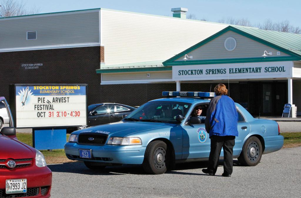 A state trooper guards the the Stockton Springs Elementary School on Oct. 31, 2008, in Stockton Springs. Randall Hofland, 55, walked inside a classroom and held 11 pupils hostage before giving himself up.