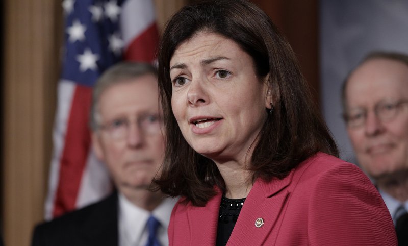 Sen. Kelly Ayotte, R-N.H., speaks to the media with Senate Minority Leader Mitch McConnell, R-Ky., in the background. Ayotte has teamed with Sen. John McCain and Sen; Lindsay Graham, also Republicans, in a rigorous grilling of U.N. Ambassador Susan Rice, questioning her role as an administration spokesperson about the fatal attack on the U.S. consulate in Benghazi, Libya.