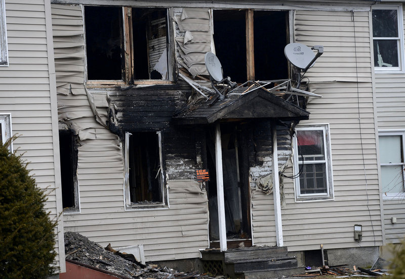 In this Monday, Dec. 10 photo, a three-unit Windham apartment building on Gray Road that was damaged by fire on Friday.