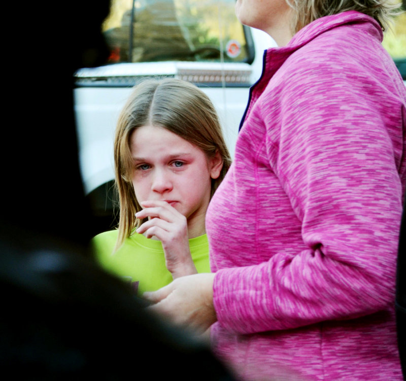 A young girl cries following the shooting Friday at the Sandy Hook Elementary School in Newtown, Conn. Experts say most of the young survivors of the massacre will get over it with no lingering effects. Some, however, may show signs of anxiety, depression or PTSD.