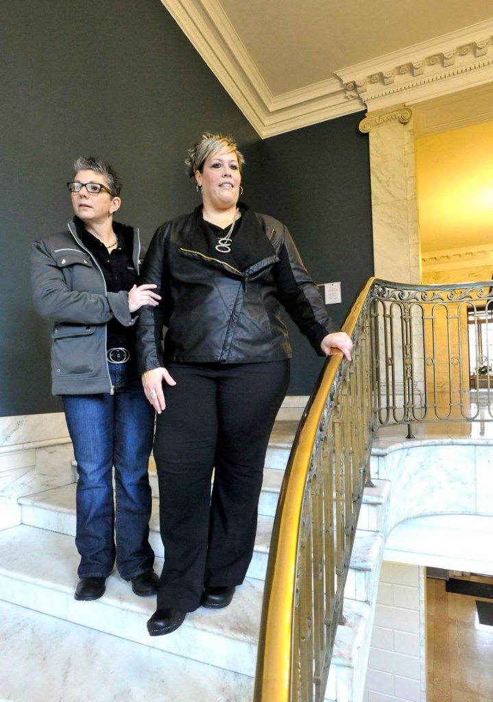 Donna Galluzzo, 49, left, and Lisa Gorney, 45, who have been together for three years, visit Portland City Hall on Wednesday ahead of their weekend wedding to select a spot for the ceremony, settling on the building's interior curving marble staircase.