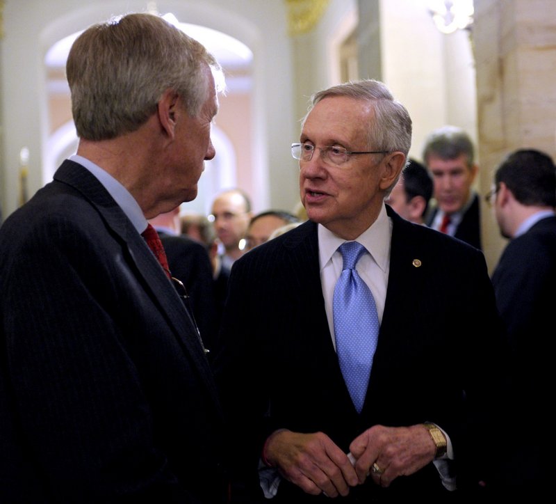 Senate Majority Leader Harry Reid of Nevada talks with Sen.-elect Angus King on Capitol Hill last month after King announced he will caucus with Democrats, adding to the party’s voting edge. King says he will remain independent.