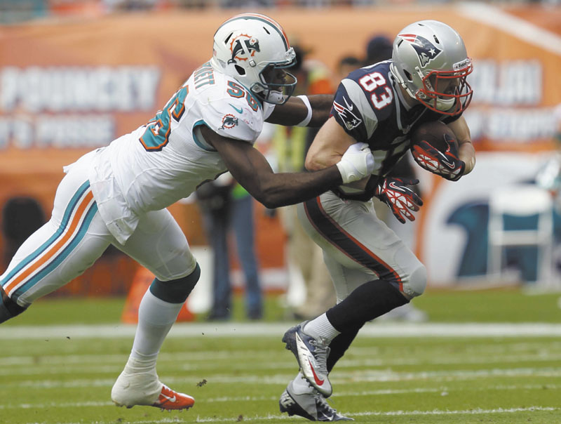 GETTING IT DONE: Wide receiver Wes Welker, right, got off to a slow start this season, but now leads the NFL with 92 catches. He’ll have to play a bigger role in the Patriots’ offense with Rob Gronkowski and Julian Edelman sidelined by injuries.
