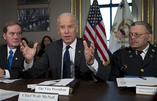 Vice President Joe Biden, flanked by Thomas Nee, left, the president of the National Association of Police Organizations and a Boston police officer, and Charles Ramsey, president of the Police Executive Research Forum and Major Cities Chiefs Association and Philadelphia police commissioner, speaks during a meeting in Washington on Dec. 20, 2012.