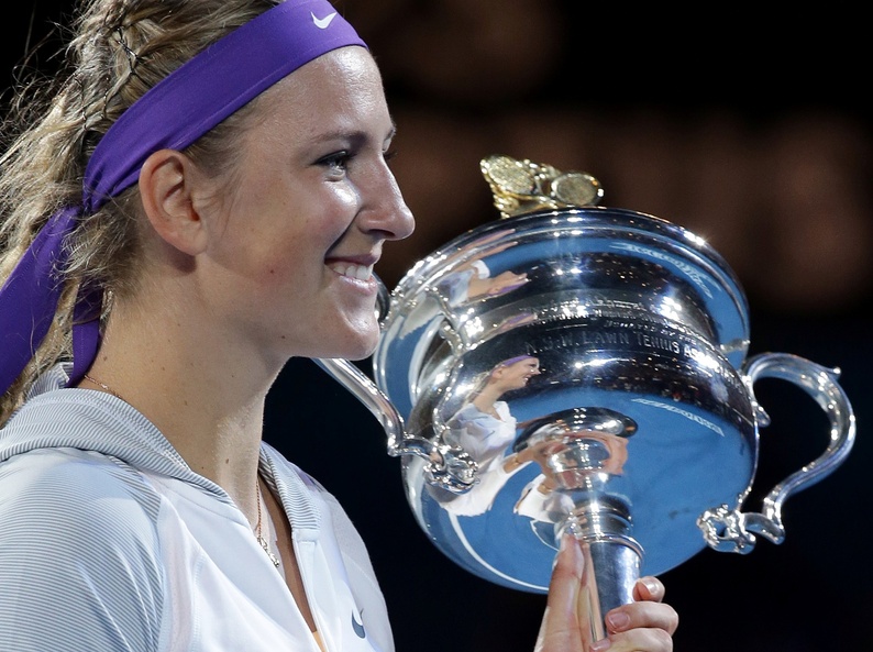 Victoria Azarenka is reflected in the trophy after winning the women's final at the Australian Open tennis championship in Melbourne, Australia, Saturday.