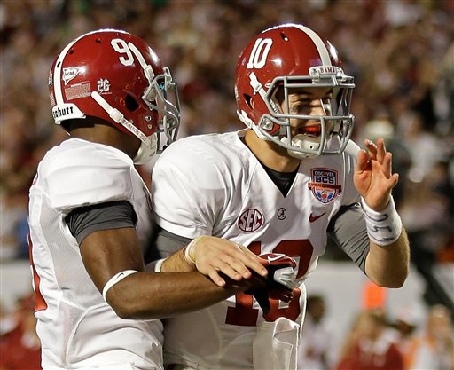 Alabama's Amari Cooper (9) celebrates his touchdown catch with quarterback AJ McCarron (10) during the second half of the BCS National Championship college football game against Notre Dame Monday in Miami.