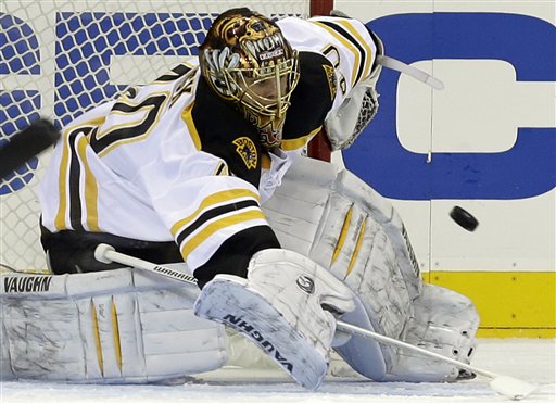 Boston Bruins goalie Tuukka Rask (40) makes a save in the first period of their NHL hockey game against the New York Rangers at Madison Square Garden in New York, Wednesday, Jan. 23, 2013. (AP Photo/Kathy Willens)
