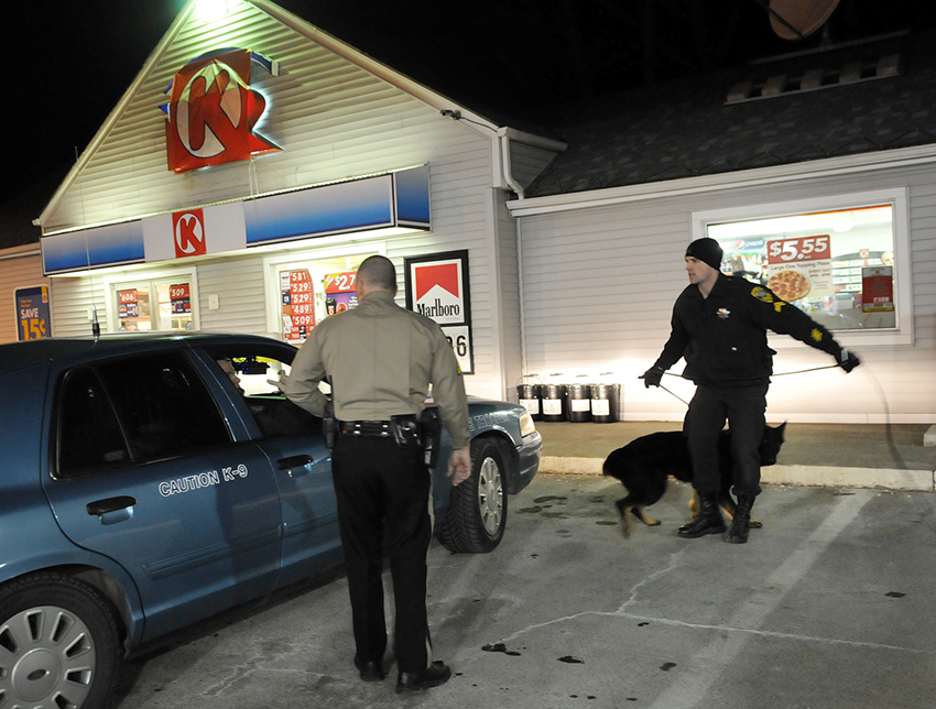 Kennebec County Sheriff's Office deputies and state troopers prepare to track a woman who robbed the Circle K convenience store Sunday evening, on Maine Avenue in Farmingdale. A women, clad in blue jeans and a dark jacket, pointed a handgun at a clerk at the store and demanded money at 7:23 p.m., according to Kennebec County Sheriff's Sgt. Scott Taylor. The robber fled on foot and no injuries were reported, Taylor said.
