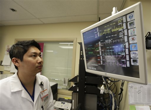 Dr. Steve Sun looks over a heart monitor display in the emergency room at St. Mary's Medical Center in San Francisco on Monday. A new government report shows the number of people seeking emergency treatment after consuming energy drinks has doubled nationwide over the last four years. Sun said he had seen an increase in energy-drink related cases at the Catholic hospital where he works on the edge of San Francisco's Golden Gate Park.