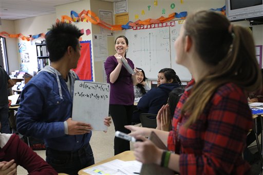 Teacher Crystal Kirch, center, talks to her students in her pre-calculus class at Segerstrom High School in Santa Ana, Calif., recently. A growing number of teachers are implementing what is known as "flipped learning."