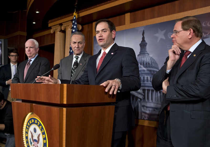 A bipartisan group of leading senators announce that they have reached agreement on the principles of sweeping legislation to rewrite the nation's immigration laws, during a news conference at the Capitol in Washington, Monday, Jan. 28, 2013. From left are Sen. John McCain, R-Ariz., Sen. Charles Schumer, D-N.Y., Sen. Marco Rubio, R-Fla., and Sen. Robert Menendez, D-N.J. The deal covers border security, guest workers and employer verification, as well as a path to citizenship for the 11 million illegal immigrants already in this country. (AP Photo/J. Scott Applewhite)