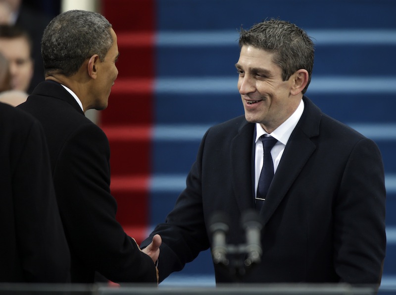 President Barack Obama, left, shakes hands with poet Richard Blanco during the ceremonial swearing-in West Front of the U.S. Capitol during the 57th Presidential Inauguration in Washington, Monday, Jan. 21, 2013. (AP Photo/Pablo Martinez Monsivais) Inauguration;US Capitol