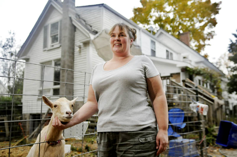 Marcina Johnson is raising pygmy goats in the back yard of their Gardiner home. The Ordinance Review Committee has sent to the Planning Board proposed rules that would allow goats and sheep to be kept on intown lots.