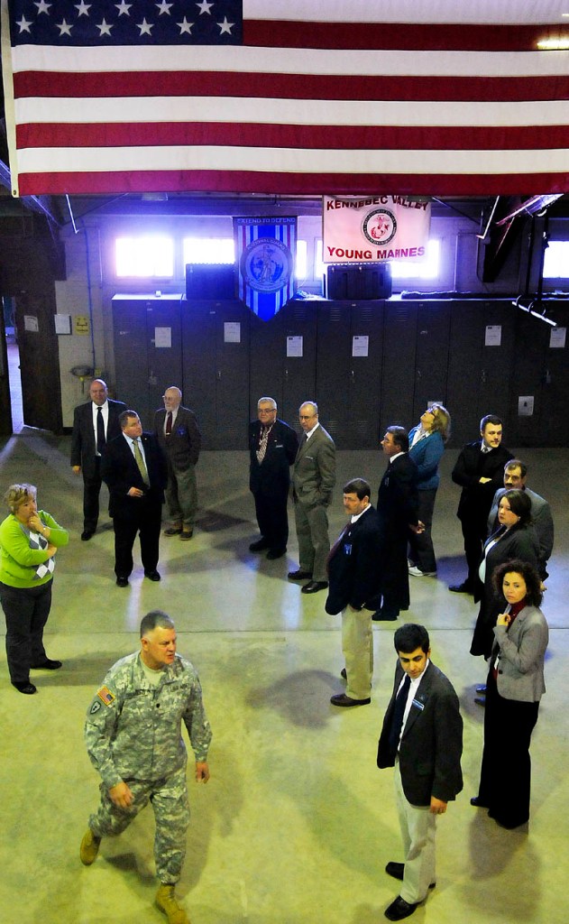 Army National Guard Lt. Col. Dwaine Drummond leads members of the Legislature's Veterans and Legal Affairs Committee on a tour Wednesday of the Gardiner armory. Soldiers with the National Guard discussed the condition of the armories across the state with the legislators.