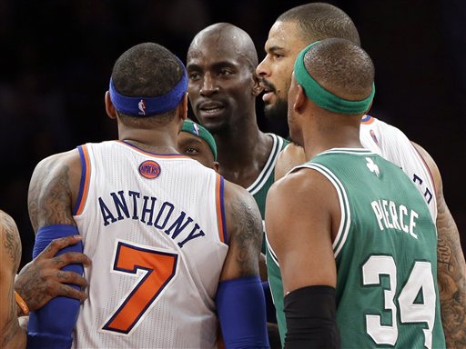 New York Knicks' Carmelo Anthony and Boston Celtics' Kevin Garnett, center, exchange words after both received technical fouls as Celtics' Paul Pierce (34) and Knicks' Tyson Chandler look on during the second half of Monday's game at Madison Square Garden.