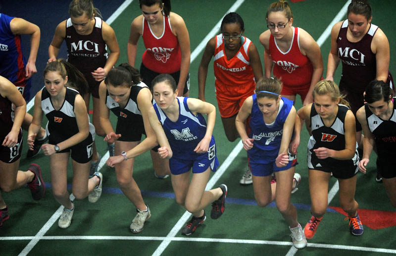 Runners competing in the girls 1-mile run leave the starting line during a high school indoor track meet at Colby College in Waterville Saturday.