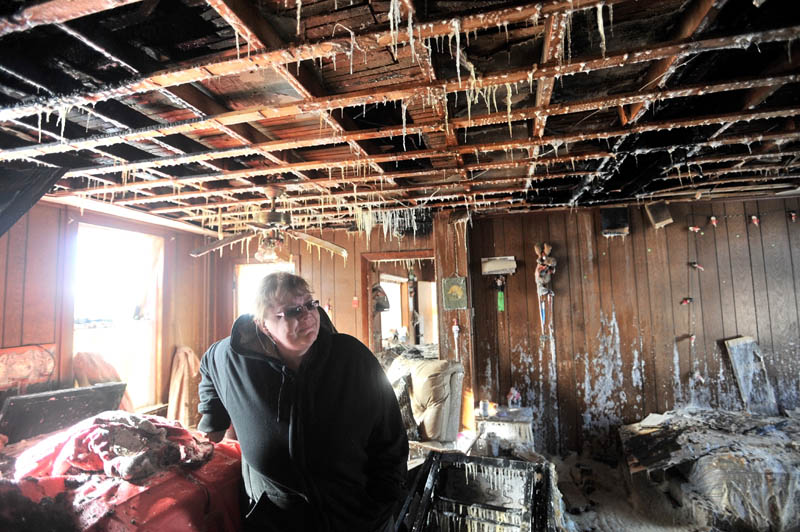 Icicles hang from the ceiling of the living room in Becky Williams' parents' Madison home, which was destroyed by fire around 3 a.m. Friday.