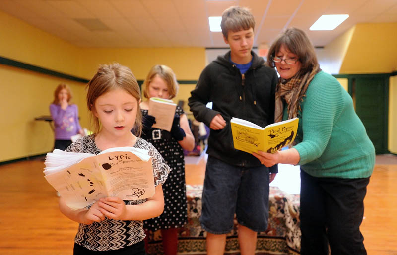 Midge Pomelow, right, rehearses a scene from "Pied Piper of Hamelin" with Cody Pomelow, 13, right center, Zoie Hills, 9, left center, and Lyric Whitaker, 6, left foreground, at Midge's Theater Arts Studio on Water Street in Skowhegan Tuesday.