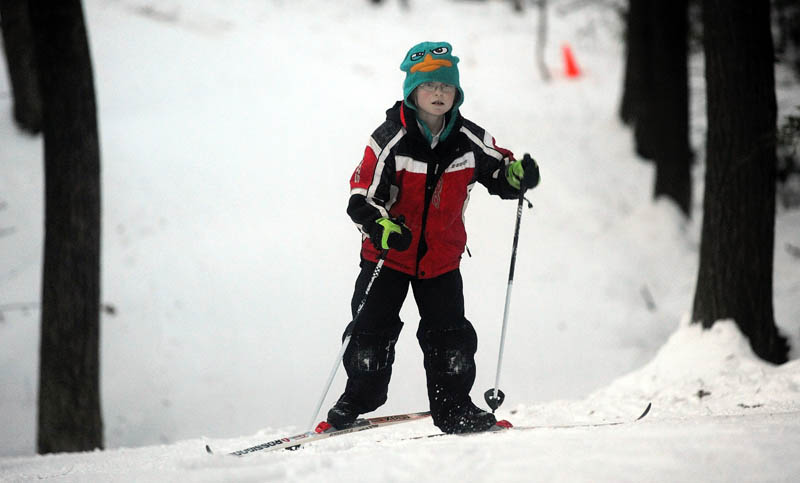 Patrick Chisum, 11, of Oakland, takes advantage of the cold temperatures and gets some laps in at the cross country ski trails at Quarry Road Recreation Area in Waterville on Friday.