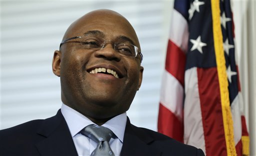 William "Mo" Cowan smiles during a news conference Wednesday where he was named interim U.S. senator to fill the seat vacated by John Kerry, who was confirmed on Tuesday as the nation's next secretary of state.