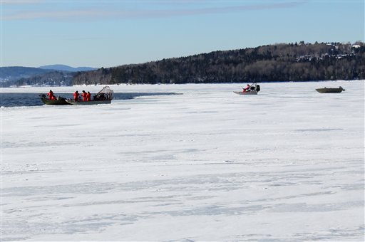 In this photo provided by the Maine Warden Service, wardens conduct search operations on Thursday for the three missing snowmobilers presumed to be in Rangeley Lake. Wardens used sonar to scan the lake bottom for approximately two hours before equipment became inoperable due to weather.