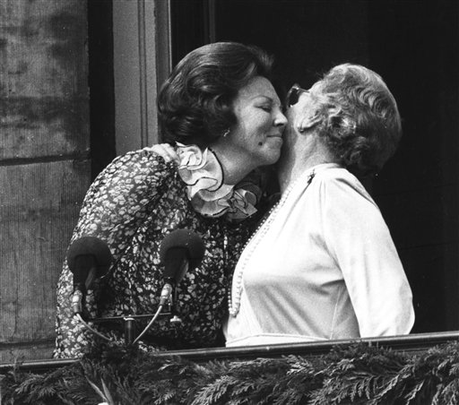 In this April 30, 1980, photo, Princess Juliana, right, just after her abdication, kisses her eldest daughter Queen Beatrix on the balcony of the Royal Palace in Amsterdam, Netherlands.